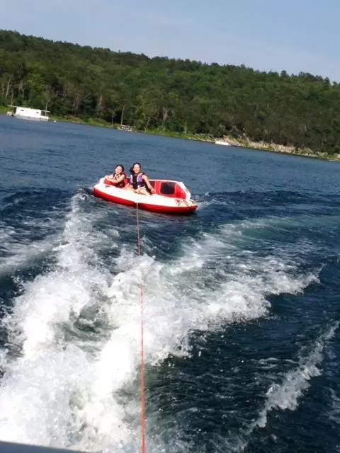 Two guests tubing on Lake Norfork